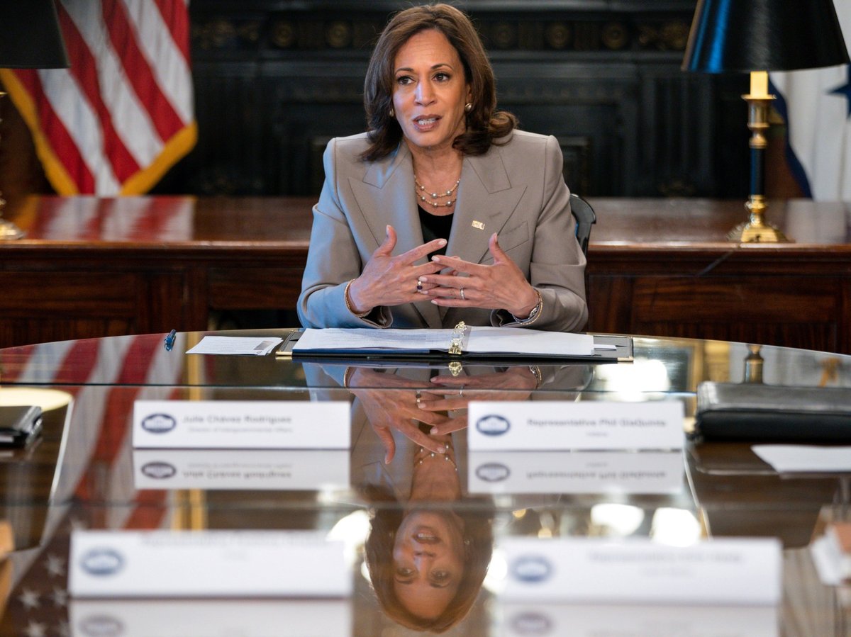 Vice President Kamala Harris is reflected in a table as she speaks while meeting with state legislators about protecting reproductive rights, Friday, July 8, 2022.