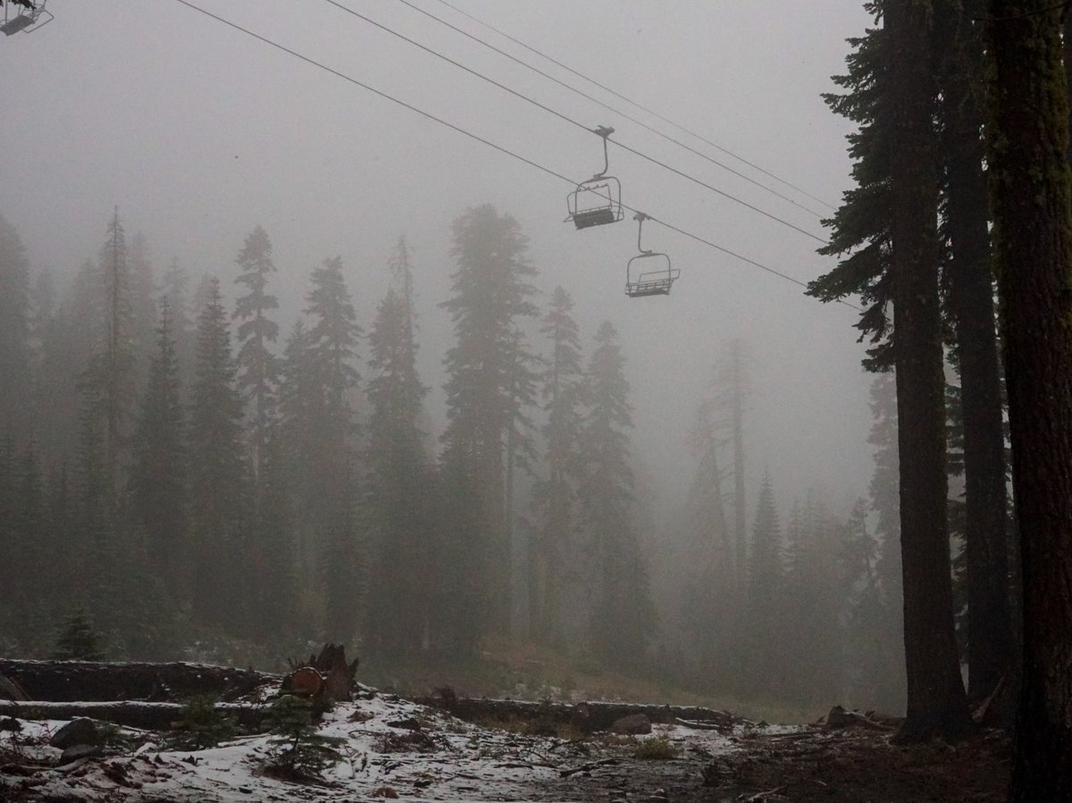 A coating of snow is seen below ski lifts at Sugarbowl Ski Resort Saturday, Aug. 24, 2024, in Donner Summit, Calif.