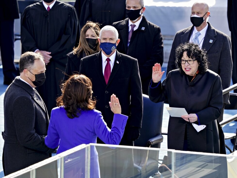 Supreme Court Justice Sonia Sotomayor (right) administers the oath of office to incoming Vice President Kamala Harris in front of the U.S. Capitol on Jan. 20, 2021, as outgoing Vice President Mike Pence (wearing blue mask) watches.