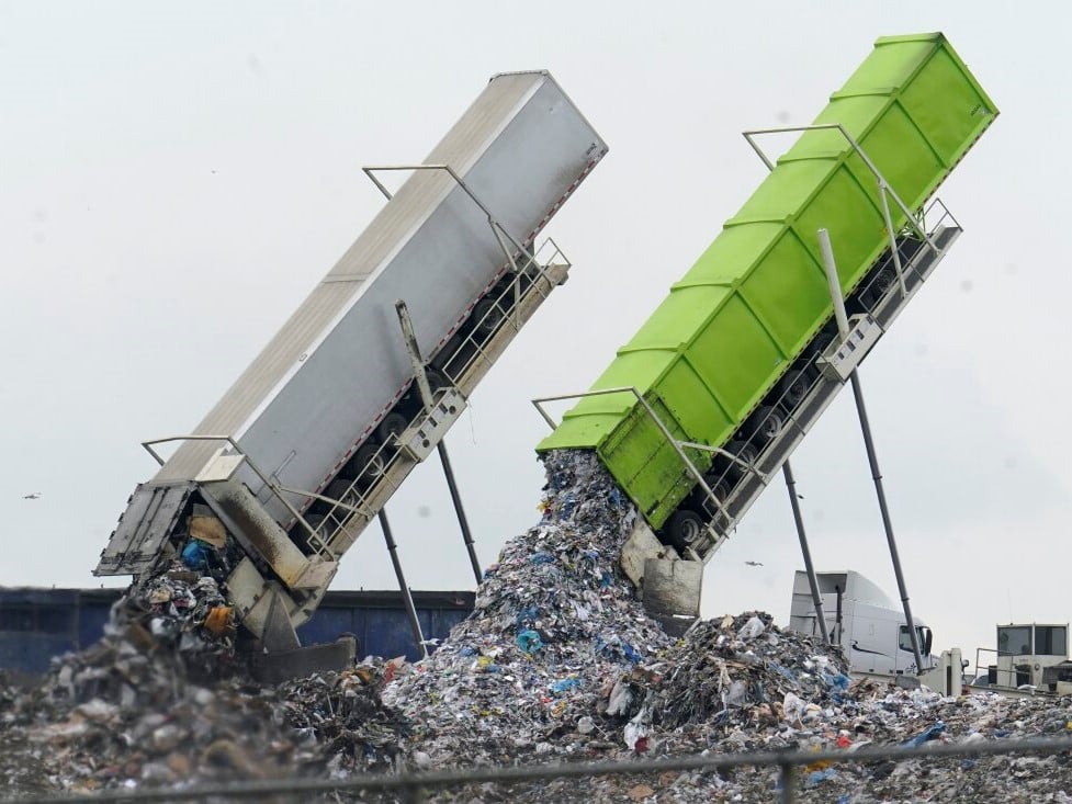 Garbage is unloaded into the Pine Tree Acres Landfill in Lenox Township, Mich., on July 28, 2022. State bans on commercial food waste have been largely ineffective, researchers found.