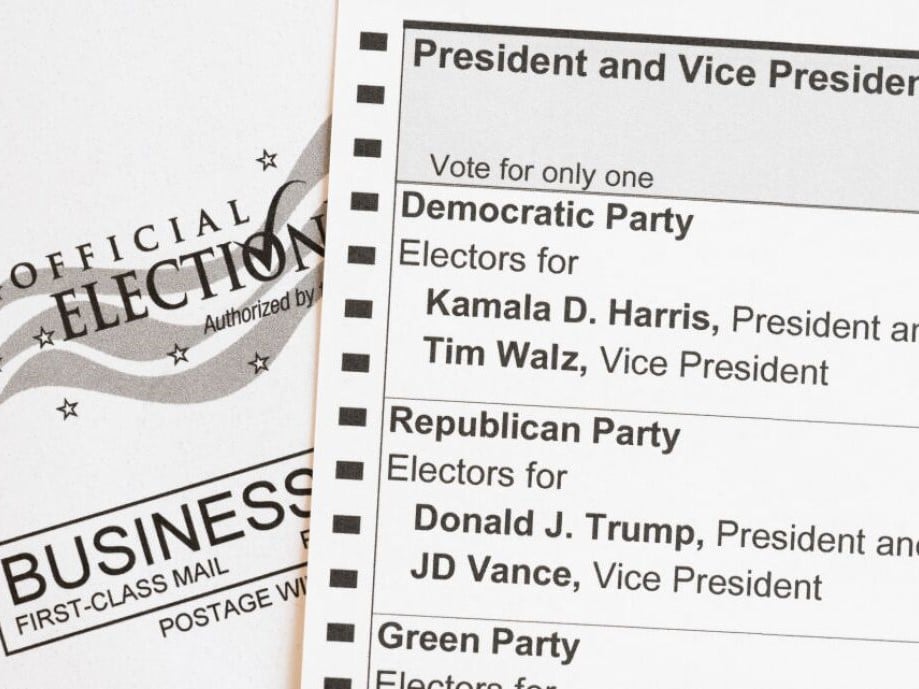In this photo illustration, an absentee-voter mail-in ballot shows the names of the Democratic and Republican presidential and vice presidential candidates in the 2024 election.