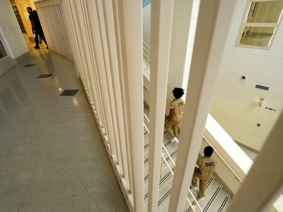 Inmates at the Cook County, Ill., jail head to a staging area at the jail's Division 11 law library before registering and voting in the local election in 2023 in Chicago.