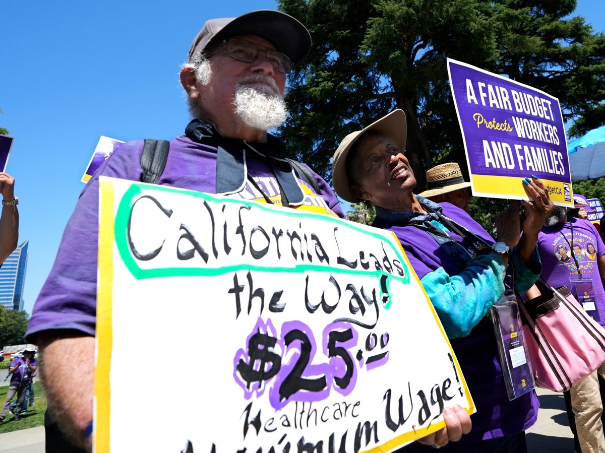 Retirees Ron Martin and Willie Mae Hampton join other supporters of the Service Employees International Union at a rally against proposed budget cuts to state provided social safety programs, in Sacramento, Calif., Tuesday, June 11, 2024.