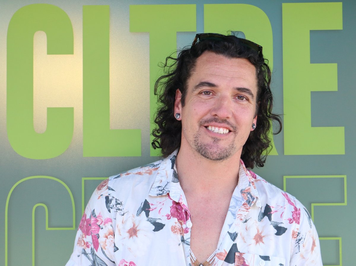 Micah Kearns stands in front of the CLTRE building in Midtown. Kearns developed a health product called the Breathing Light. (Photo by Keyshawn Davis)