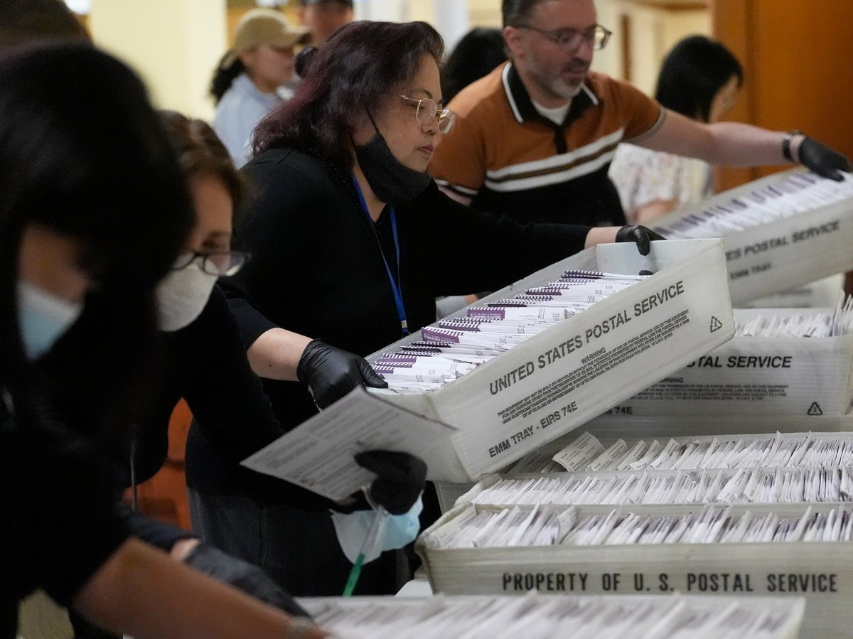 Department of Elections workers gather ballots at City Hall in San Francisco, Tuesday, Nov. 5, 2024.
