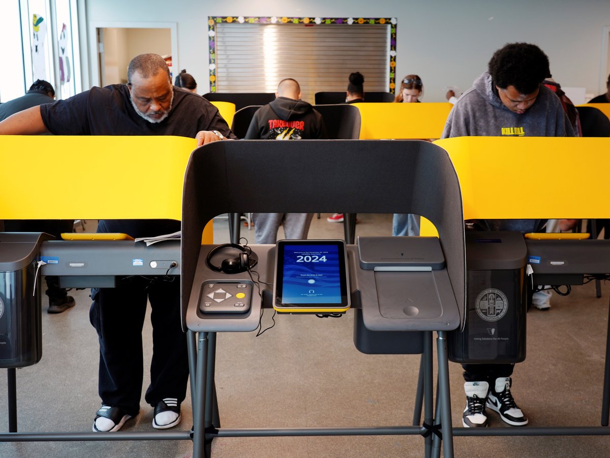 Voters work on their ballots at a polling place at the Michelle and Barack Obama Sports Complex on Election Day, Tuesday, Nov. 5, 2024, in Los Angeles.