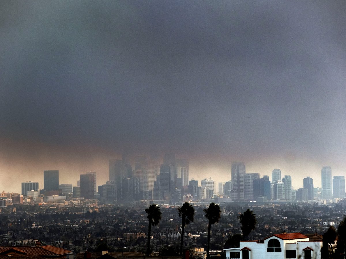 Thick heavy smoke from wildfires shrouds downtown Los Angeles on Wednesday, Jan. 8, 2025.