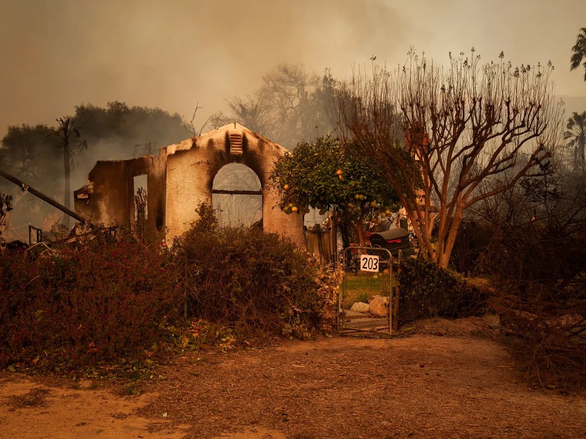 The remains of a smoldering home in an Altadena neighborhood affected by the Eaton Fire on Jan. 8, 2025.