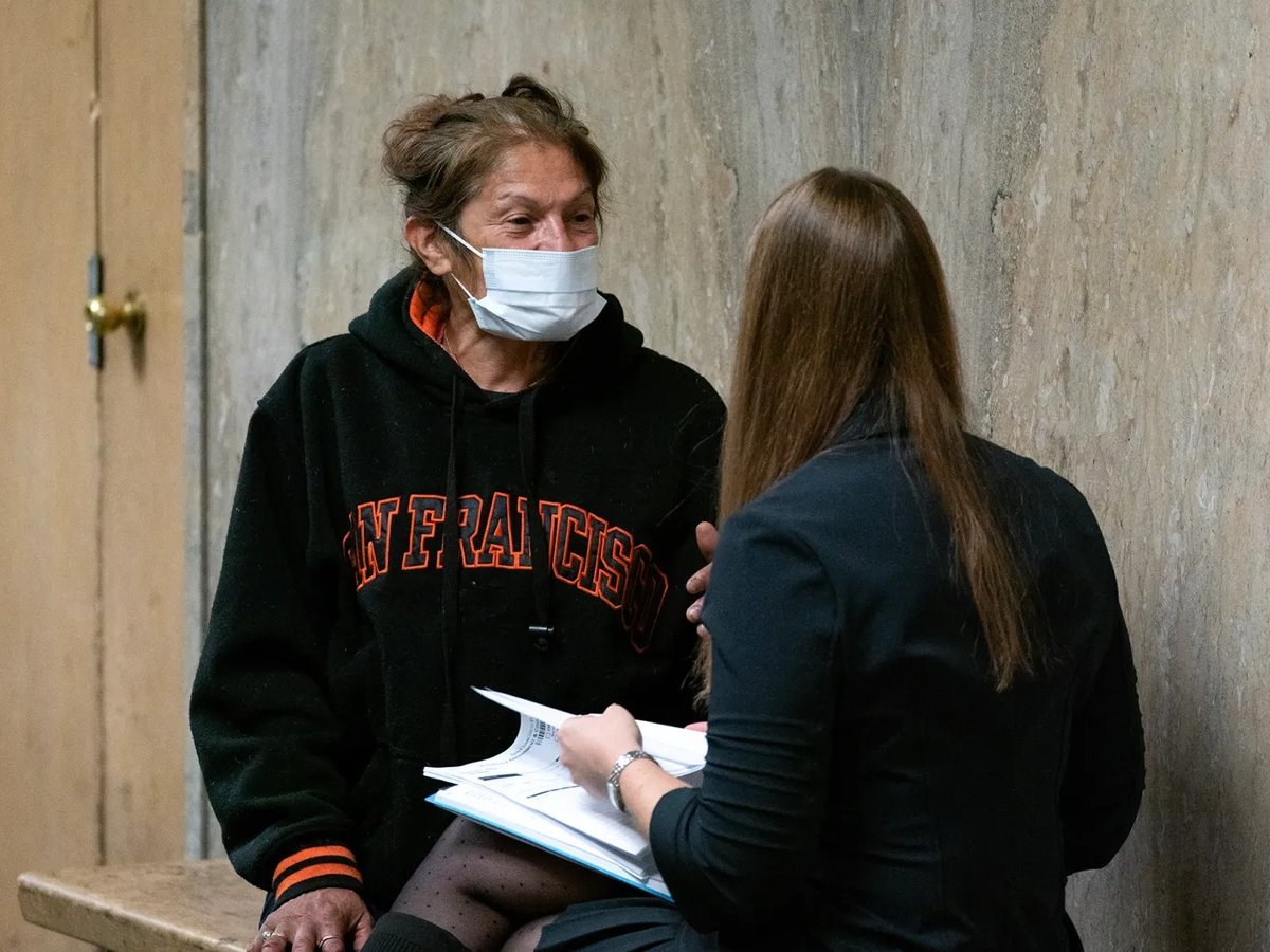 Linda Vazquez, 52, meets with San Francisco Public Defender, Samantha Perez, before her arraignment for ‘unlawful lodging’ at the Hall of Justice in San Francisco on Nov. 27, 2024.