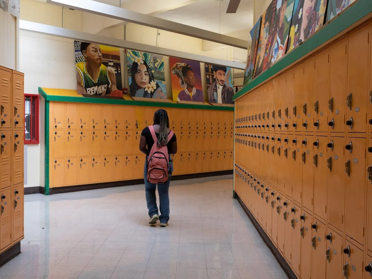 A student walks down a hallway at Fremont High School in Oakland on October 10, 2023.