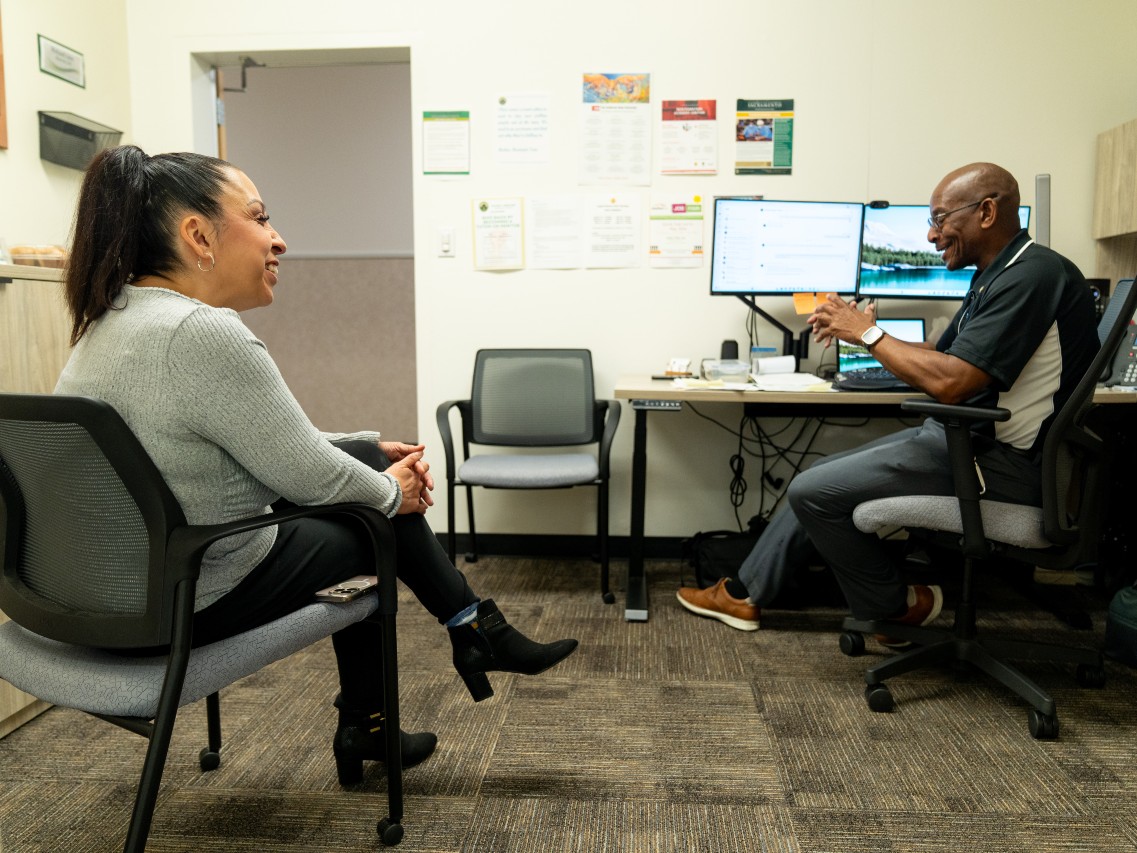 Clover Agency case manager Michelle Sotelo (left) and Michael Love, outreach coordinator for Project Rebound, discuss the importance of advocacy work for formerly incarcerated individuals at Sacramento State.