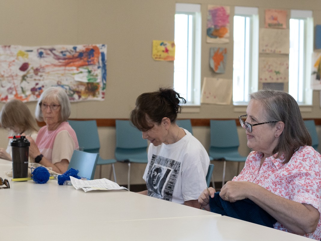 Lorraine Carter Salazar works on a knitting project at a craft group she attends weekly at a Sacramento library branch.