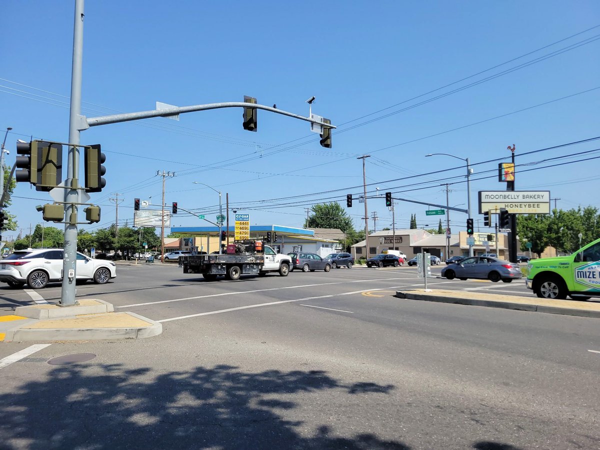 Cars drive by Thursday, June 5, 2025, at the intersection of Folsom Boulevard and 65th Street in Sacramento.