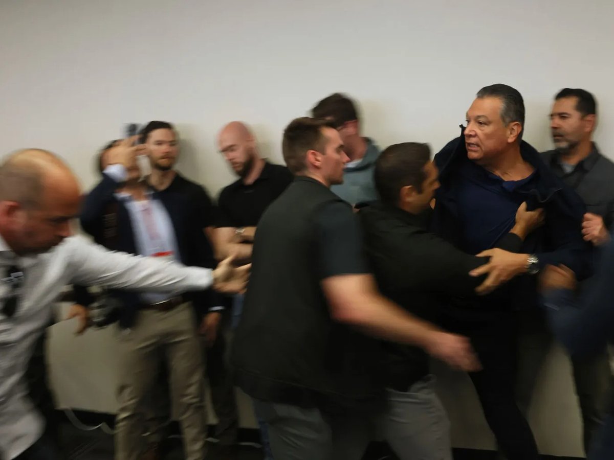 U.S. Sen. Alex Padilla is pushed out of the room as Homeland Security Secretary Kristi Noem holds a news conference regarding the recent protests in Los Angeles on June 12, 2025.