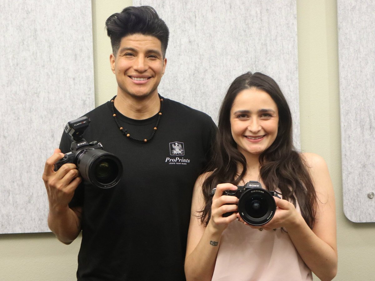 Abygail and Juan Padilla at CapRadio with their cameras they use to shoot for their events.