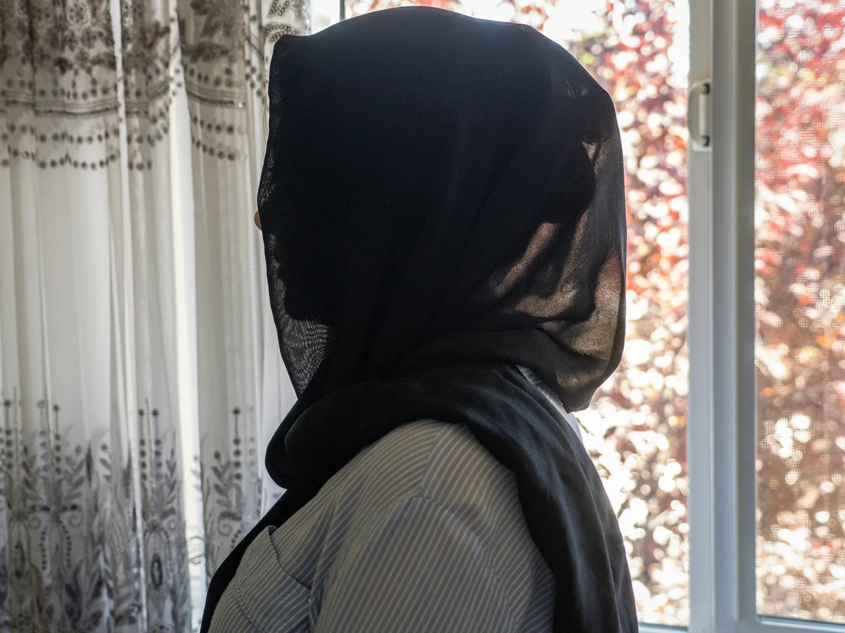 Marwa stands by the window of her apartment in Rocklin, on July 16, 2025. Her other children remain separated from her due to immigration policy changes enacted during the Trump administration.