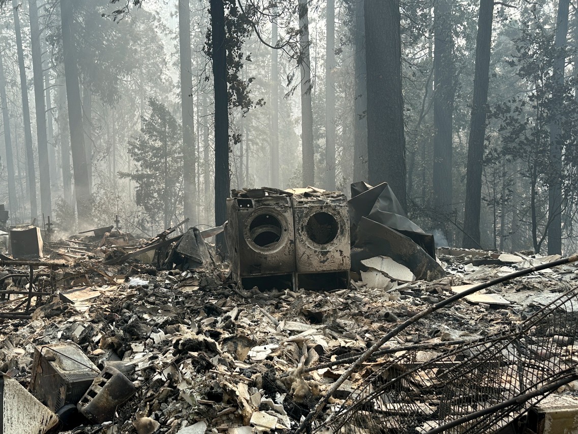 A property damaged by wildfire is seen in the aftermath of the Park Fire, Sunday, July 28, 2024, in the Cohasset community of Butte County, Calif.