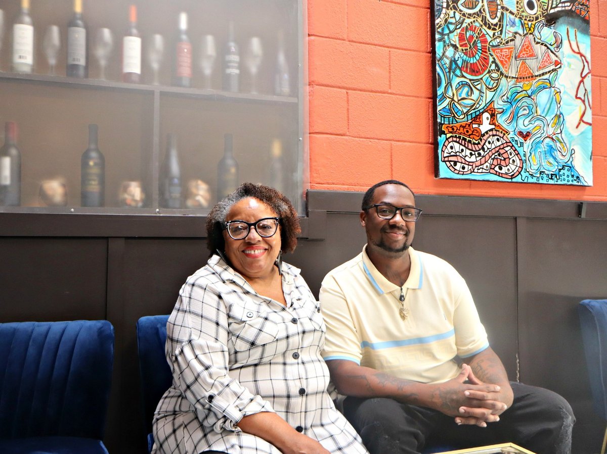 (L-R) Cynthia Dees Brooks and Jermaine Tilson inside the lounge area of TAP Wine Lounge on Friday, August 1.