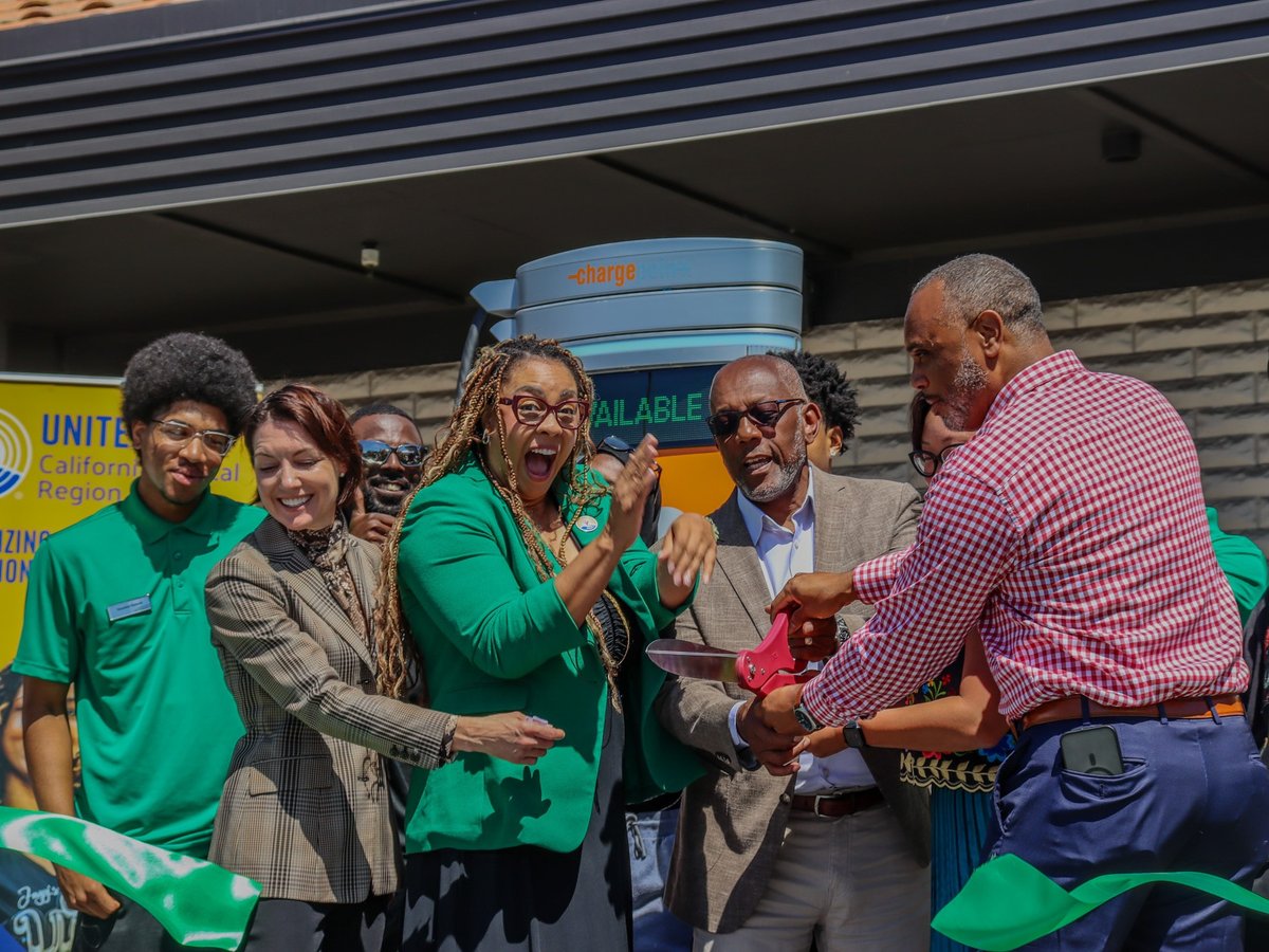 Organizers and students cut the ribbon to celebrate the launch of a new EV charging hub at South Sacramento Christian Center on Aug. 5.