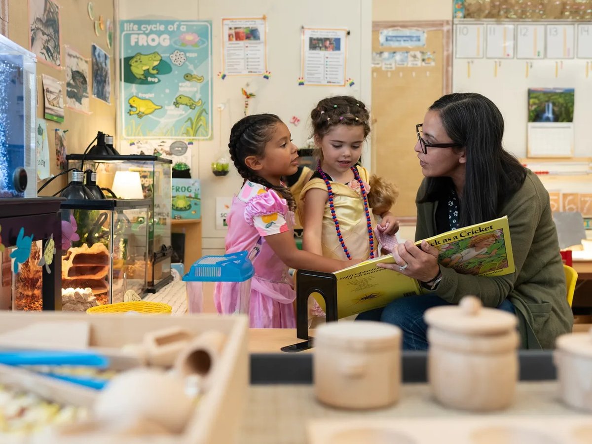 Transitional kindergarten instructional assistant Nancy Espino reads a book about crickets to children at Silverwood Elementary School in the Mt. Diablo Unified School District in Concord on Aug. 11, 2025.