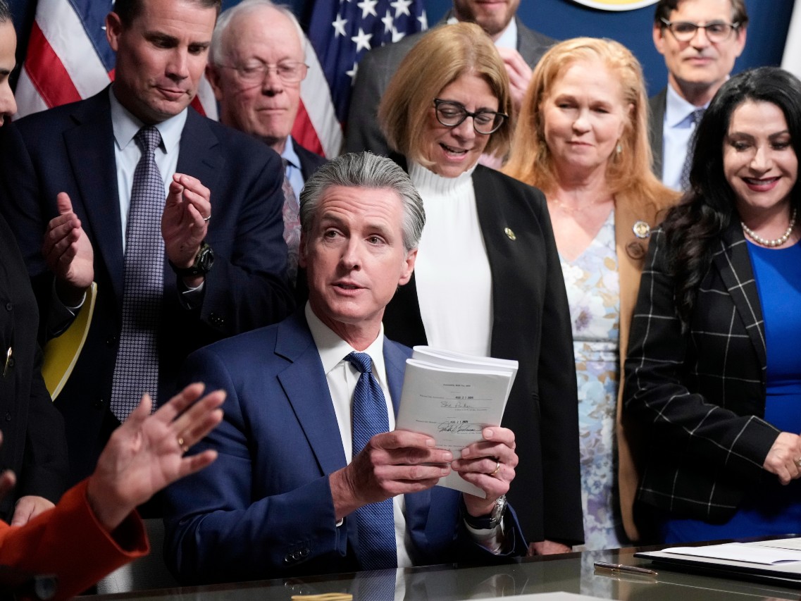 California Gov. Gavin Newsom signs legislation calling for a special election on a redrawn congressional map on Thursday, Aug. 21, 2025, in Sacramento, Calif.