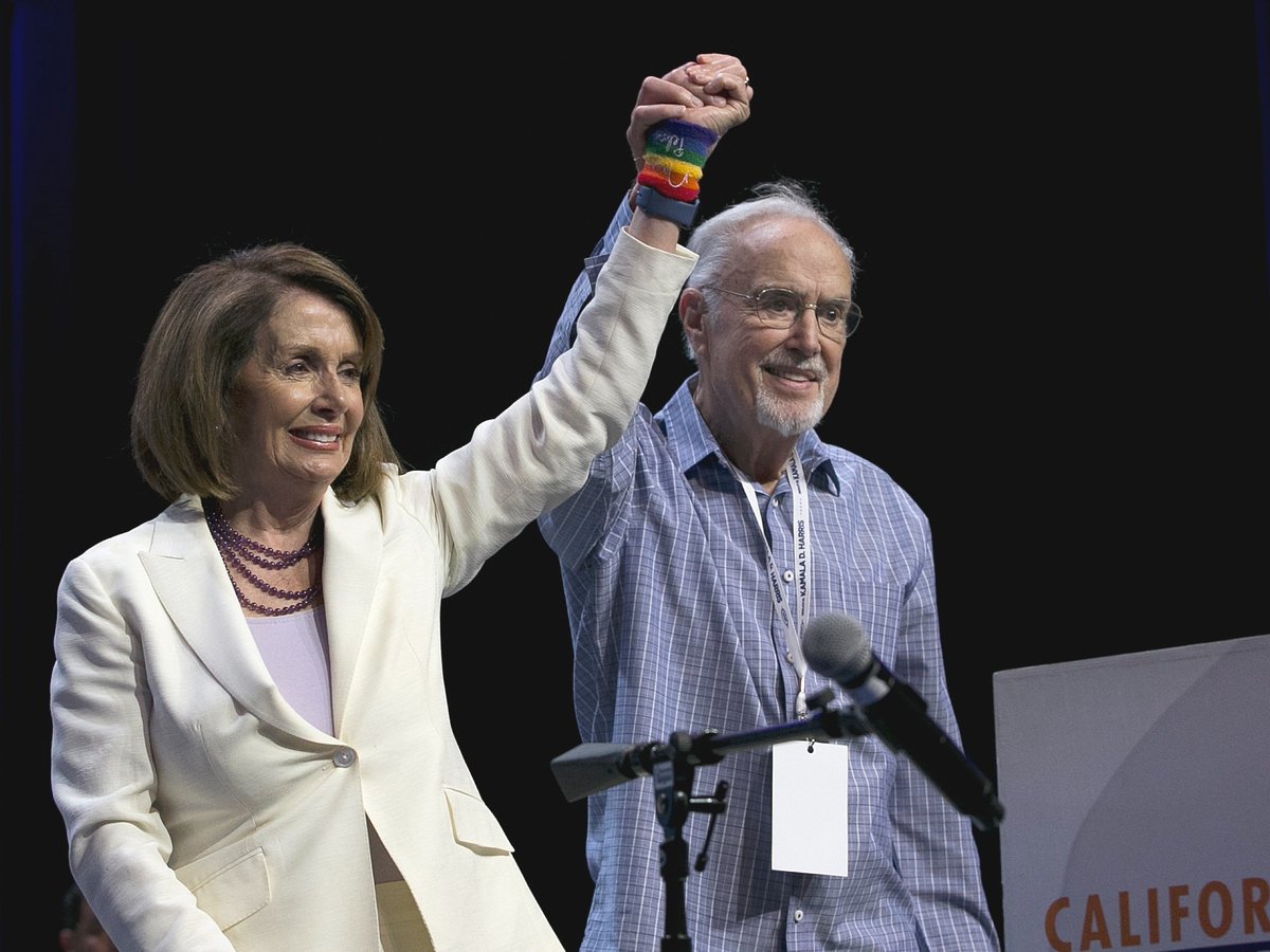 Rep. Nancy Pelosi, D-Calif., and California Democratic Party Chairman John Burton raise their arms together in celebration during the California Democratic Party Convention in Sacramento, Calif., on Saturday, May 20, 2017.