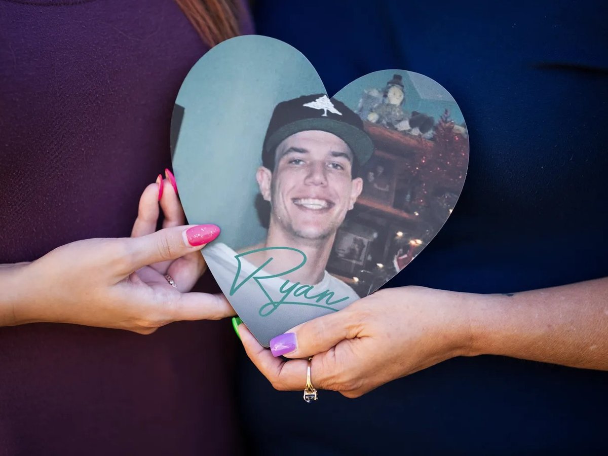 Haley Matlock, left, Ryan Matlock's sister, and Christine Dougherty, Ryan's mother, hold a photo of Ryan at their home in Yucaipa on June 12, 2024.
