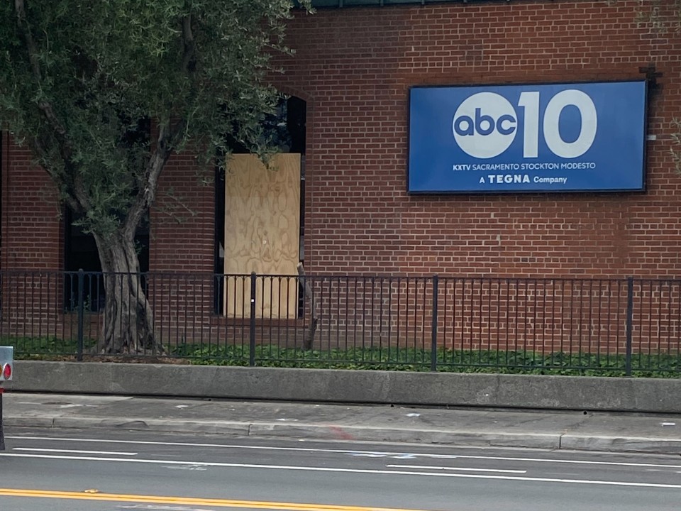 A boarded-up window outside the ABC10 building after several bullets flew through it Friday afternoon. Sept. 19, 2025