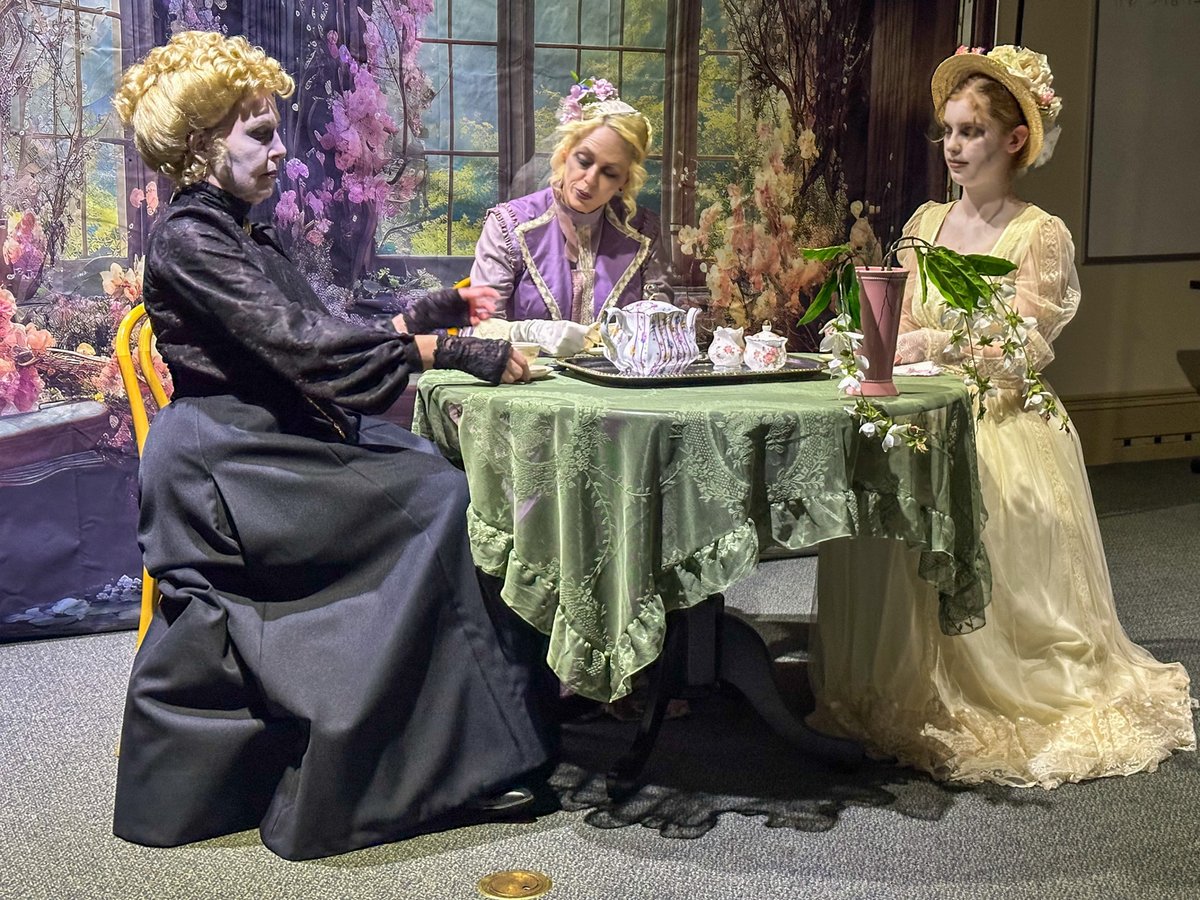 Actors perform a “ghost tea party” scene inside the Sacramento History Museum on Friday, Oct. 11, 2025, as part of this year’s tour.