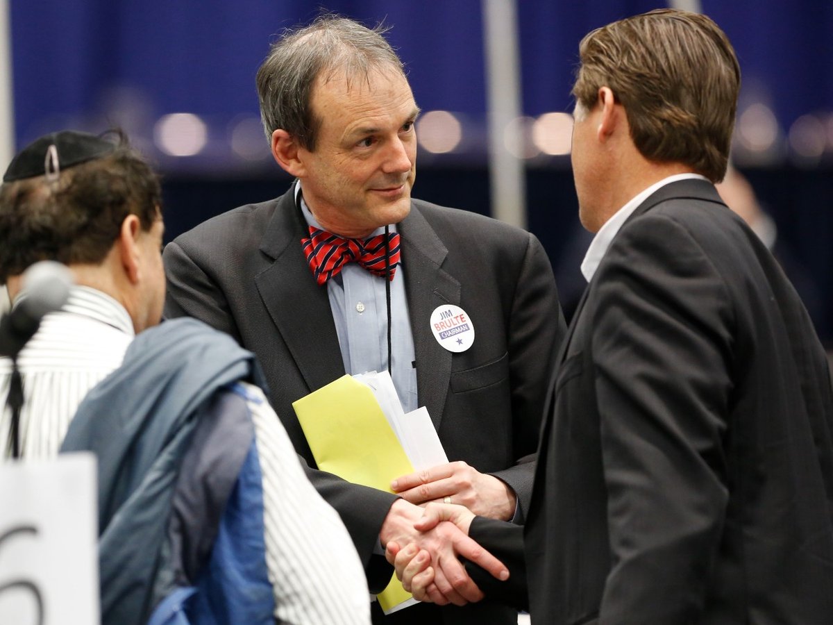 Charles Munger Jr. chairman of the Santa Clara County Republican party, center, talks with Assemblyman Brian Jones, R-Santee, right, at the California Republican Party convention in Sacramento, Calif., Sunday, March 3, 2013.