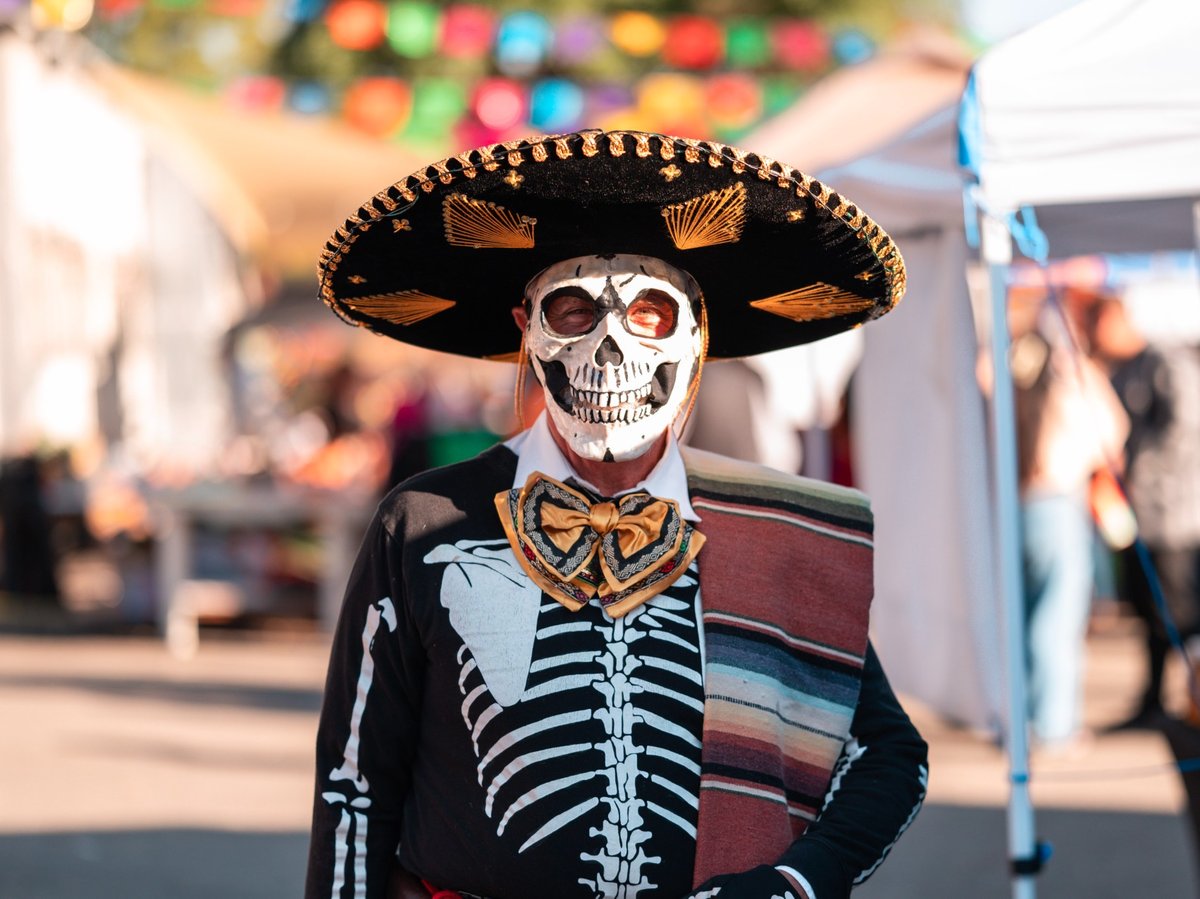 One participant at the El Panteon de Sacramento celebration in 2024 with skull face painting for Dia de Muertos.
