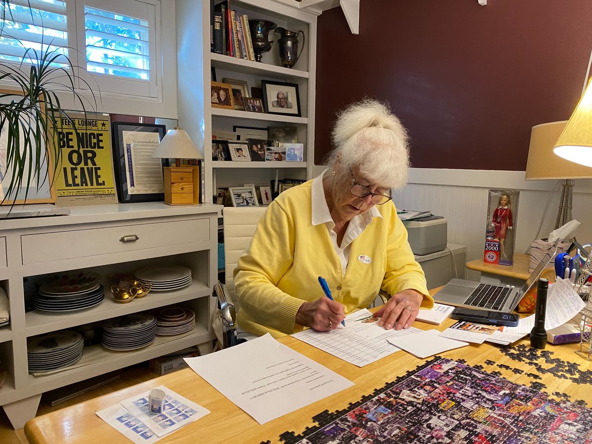 Tee May Duggan writes postcards from her home office in Tahoe Vista urging voters to support Proposition 50. October 5, 2025.