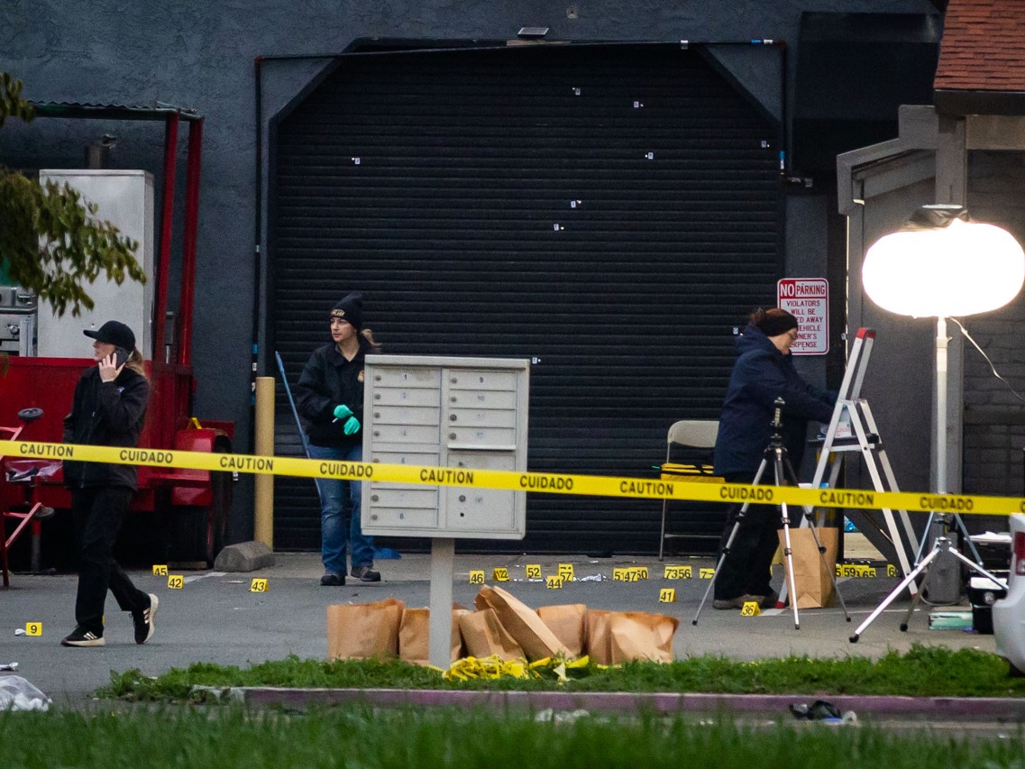 Investigators examine the scene of a mass shooting Sunday, Nov. 30, 2025, in Stockton, Calif.