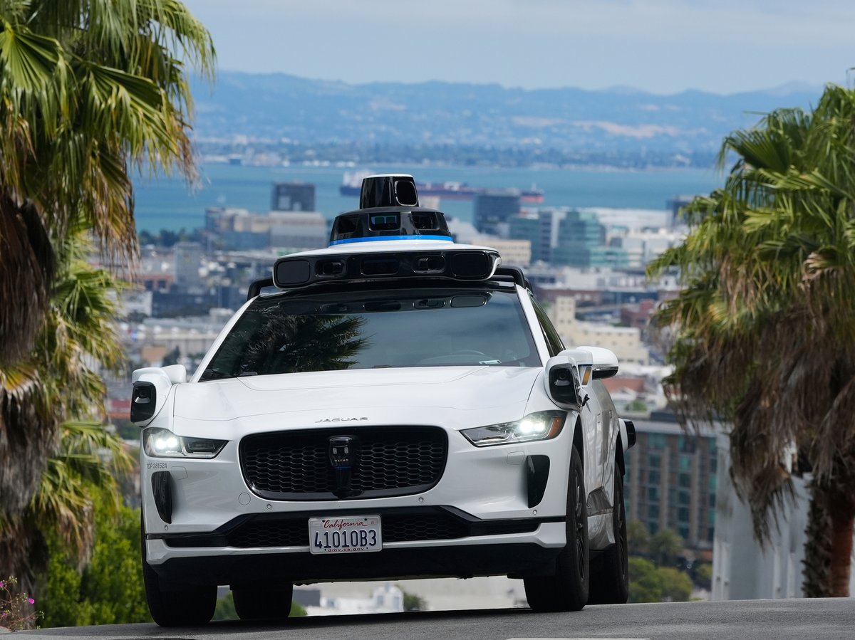 A Waymo car drives up a hill in San Francisco, Thursday, Sept. 4, 2025.