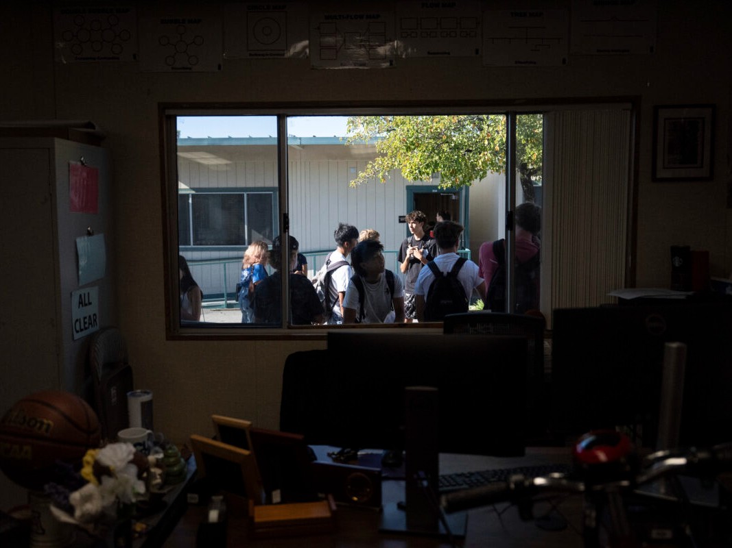Students wait outside a classroom at Valencia High School in Santa Clarita.