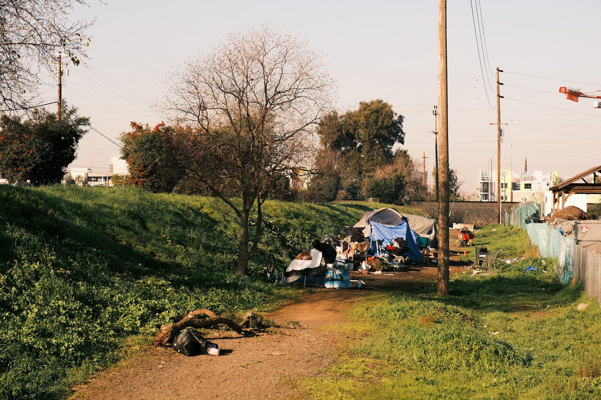 An unhoused encampment near the intersection of Ramona Avenue and Folsom Boulevard in Sacramento on Jan. 13, 2025.