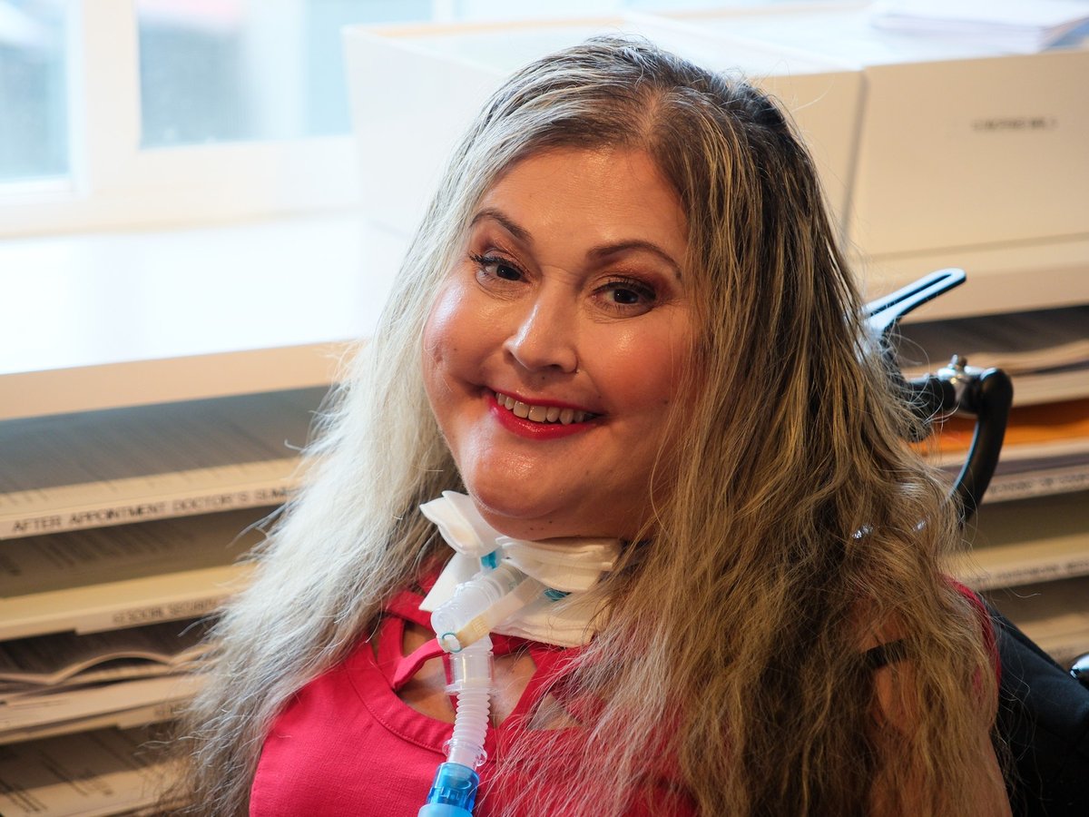 Sara Granda in her Davis home on Feb. 19, 2026. She’s been a wheelchair user and respirator dependent since a car crash paralyzed her from the neck down in 1997.