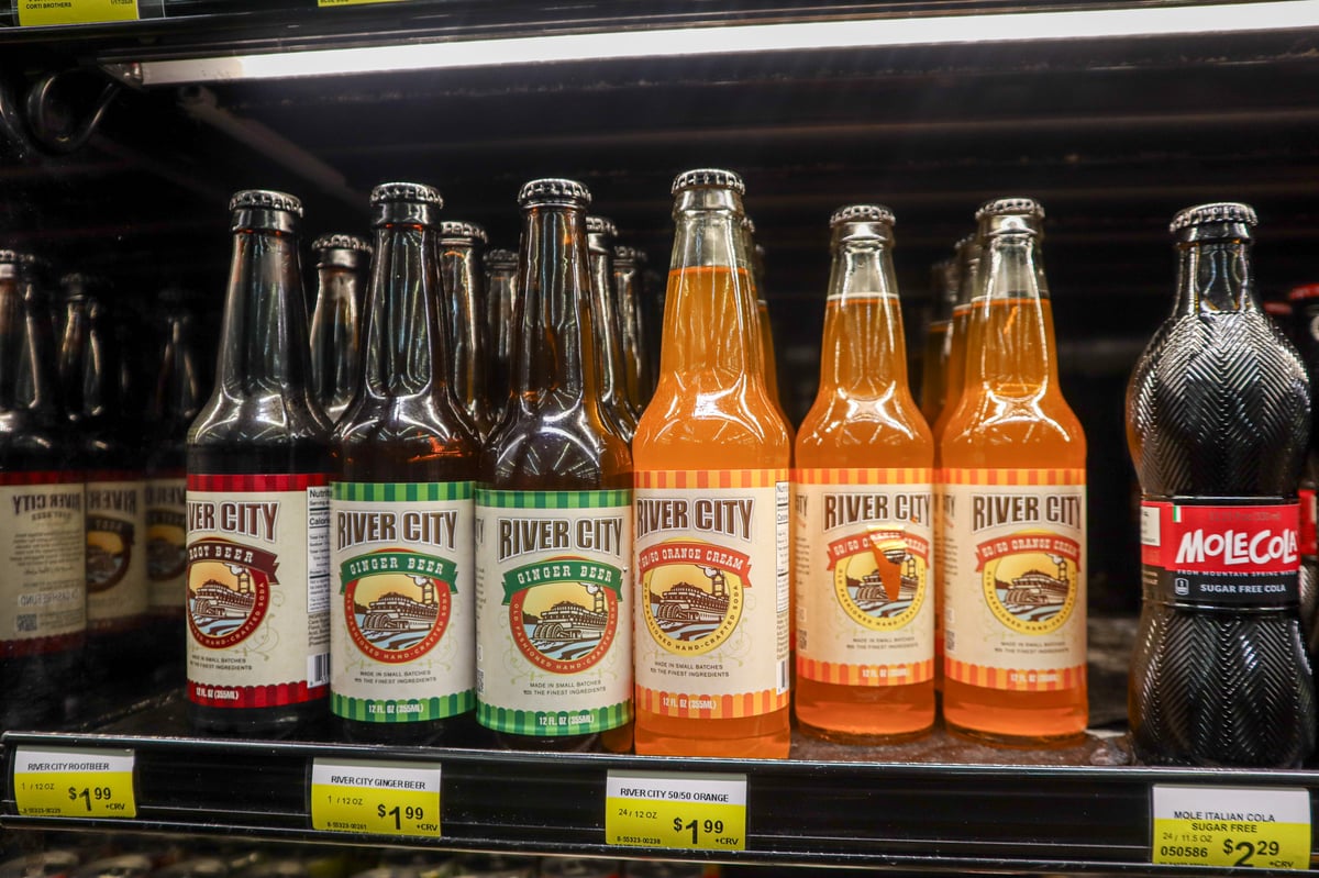 Bottles of River City Root Beer sit on a refrigerator shelf at Corti Brothers grocery store in East Sacramento on Wednesday, Feb. 25, 2026.