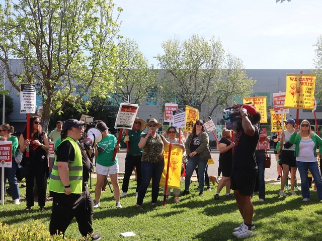 Teachers and parents protest at the Natomas Unified School District office Tuesday, March 17, 2026. The strike ended Thursday after both sides came to a tentative agreement.