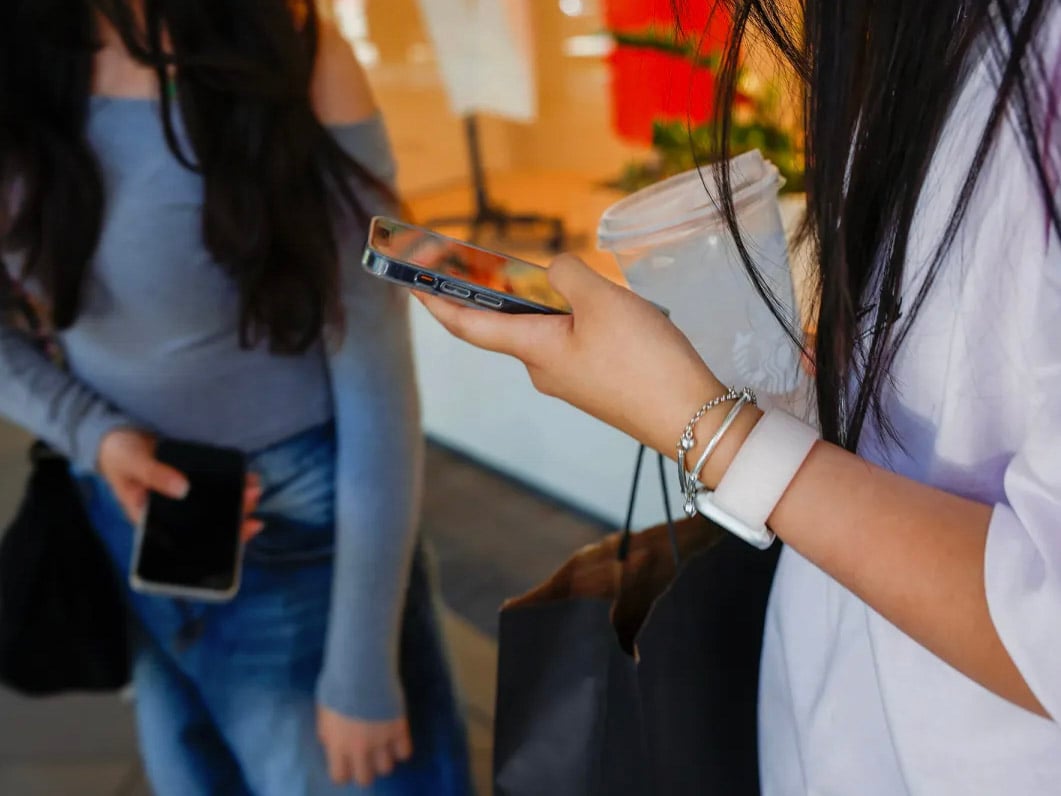 Tech giants lost a personal injury case in Los Angeles Superior court. Top executives like Meta CEO Mark Zuckerberg testified. Teenagers look at their phones at Santana Row in San Jose on July 2, 2024.