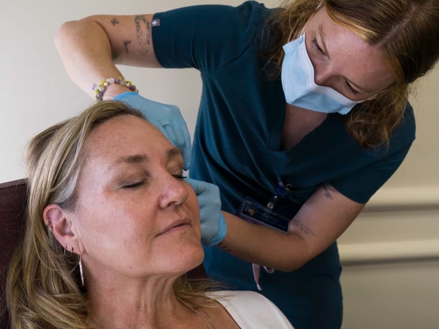 Samantha Pohlman, a registered nurse, performs a cosmetic treatment procedure on Christine Ruiz at Planned Parenthood - B Street in Sacramento, Calif., Friday, March 20. Planned Parenthood is expanding its services by offering cosmetic treatments.