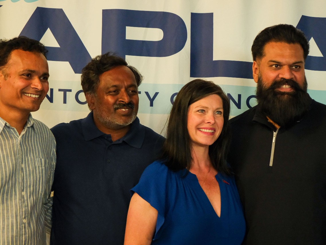Lisa Kaplan poses for a photo with supporters at her primary results watch party on June 2, 2026.