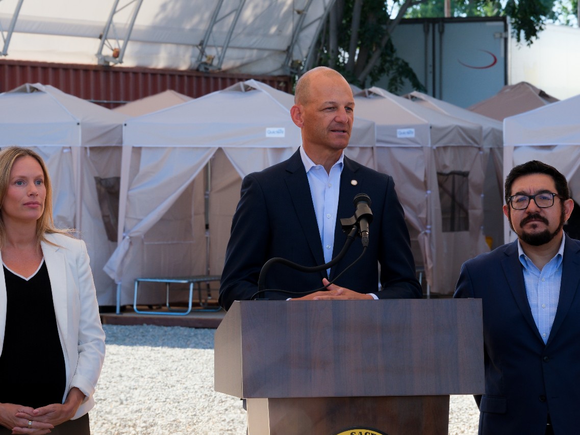 Sacramento Mayor Kevin McCarty (middle) said the city's new "safe camping" site in the River District is one more option for the area's homeless population. He was joined by Councilmembers Caity Maple (left) and Eric Guerra (right).