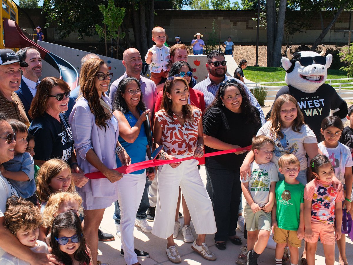 West Sacramento mayor Martha Guerrero cuts the ribbon at the reopening of Westacre Park surrounded by West Sacramento city councilmembers Dawnté Early (L) and Quirina Orozco (R) and members of the community on July 9, 2026.
