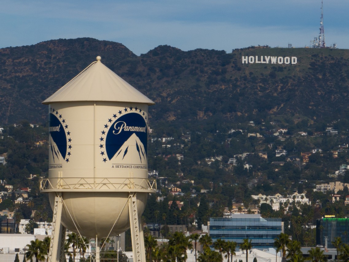 The Paramount Pictures water tower is seen in Los Angeles, Dec. 18, 2025, with the Hollywood sign in the distance.
