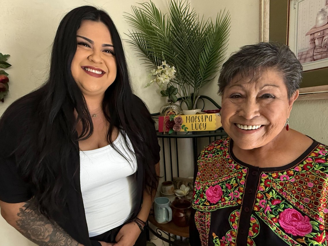Josefina Linares (left), a care manager with the social services provider Titanium Healthcare, helps Medicaid patient Lucy Rodriguez manage her medical appointments and chronic diseases, and even helps pick up boxes of fresh fruits and vegetables.