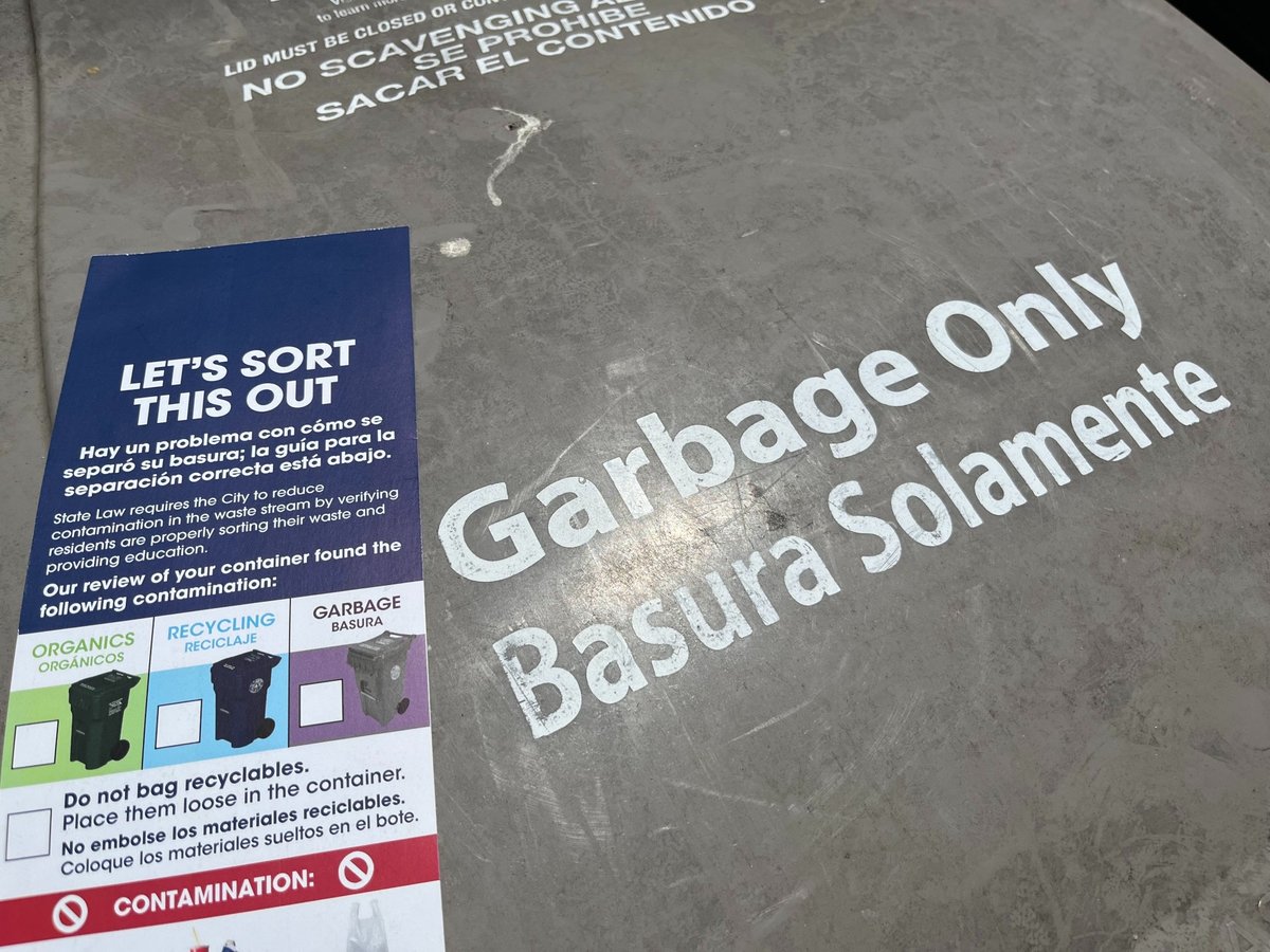 "Let's sort this out" trash bin sticker on a grey waste bin in the city of Sacramento on July 15, 2026.