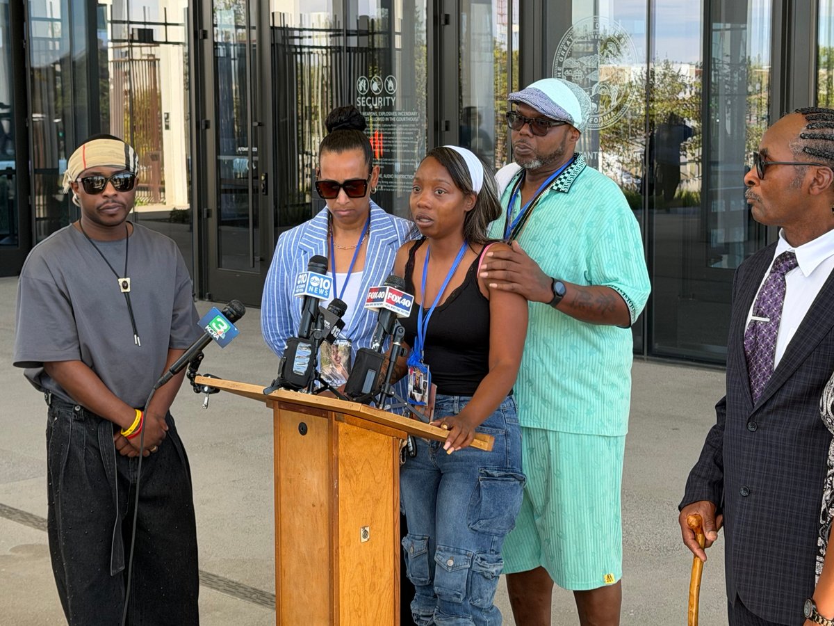 EMPACT founder Leia Schenk (second from left), Johntezha Alexander (center) and John Alexander (second from right), family members of 21-year-old victim Johntaya Alexander, speak after a mistrial was declared Tuesday, July 21, 2026 in Sacramento.
