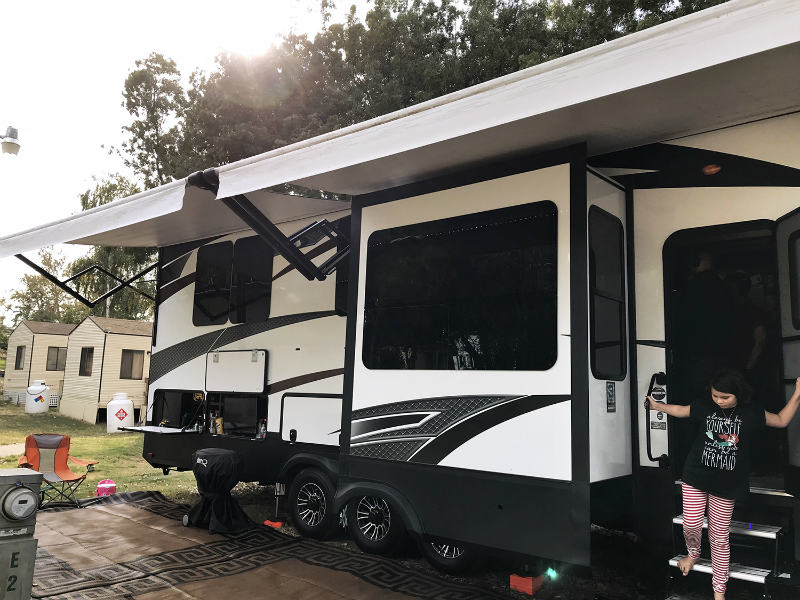 Michelle’s daughter walks out the RV.