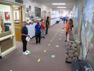 In this Aug. 18, 2020, file photo, students return to Greenbrae Elementary School in Sparks, Nev., for the first time since March with mandatory masks and social distancing to help guard against the spread of the coronavirus.
